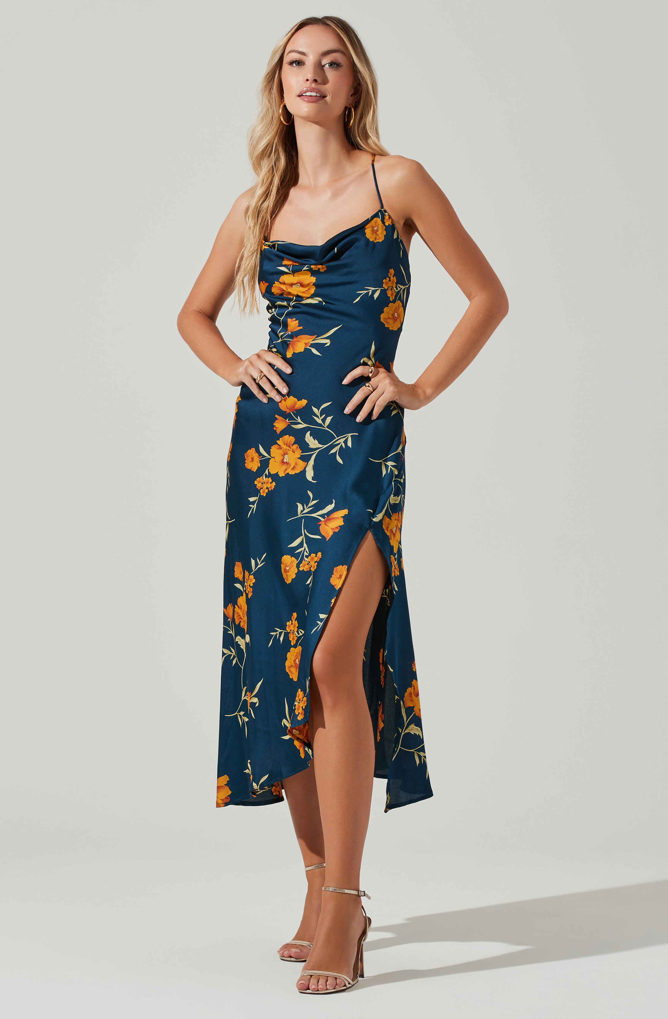 Blue Cowl Sheath Dress - This dress is a cool option to pull off your holiday look. It flaunts a modish cowl neck. This dress goes well with a pair of suede pumps and an envelope clutch.