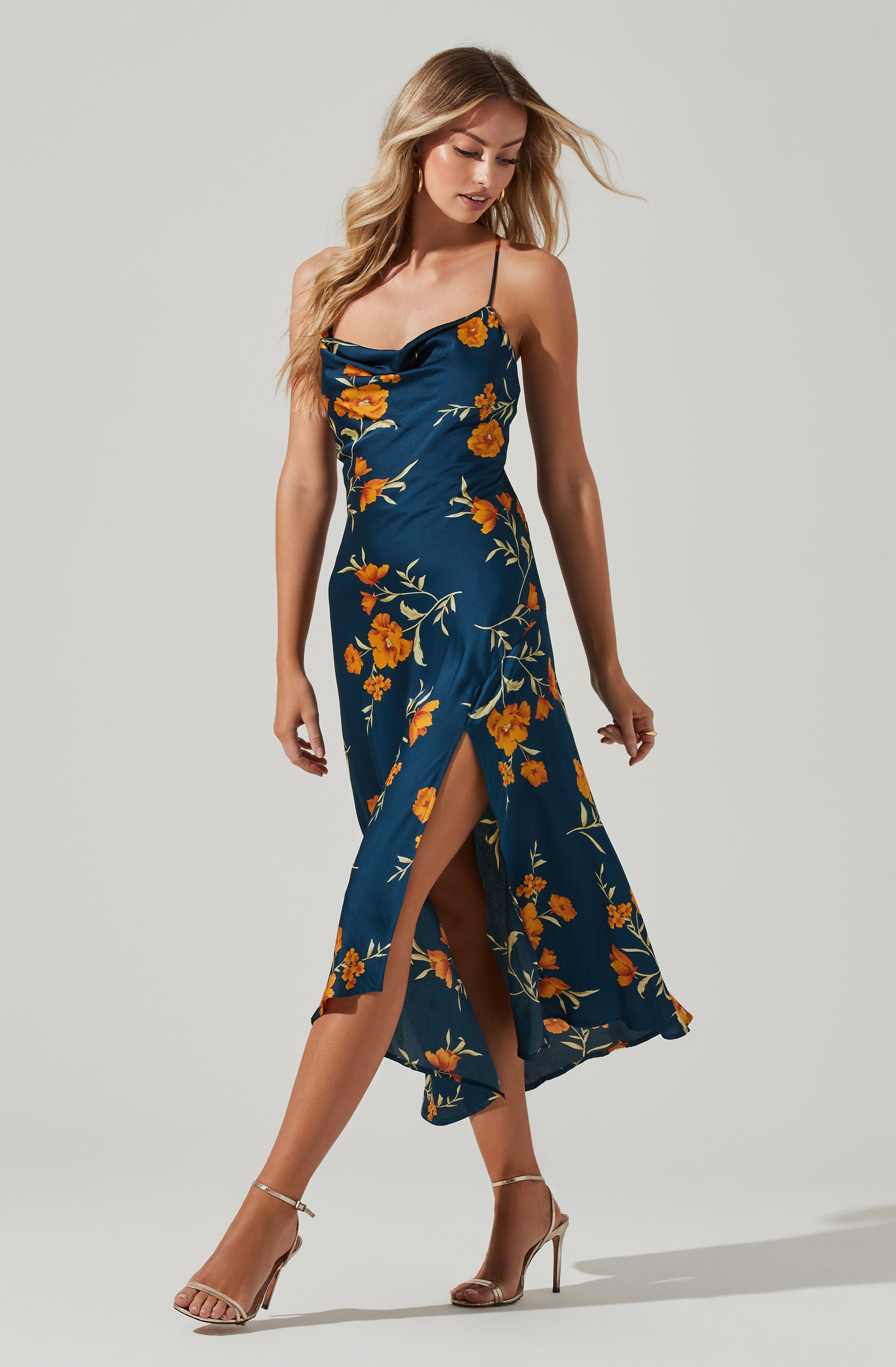 Blue Cowl Sheath Dress - This dress is a cool option to pull off your holiday look. It flaunts a modish cowl neck. This dress goes well with a pair of suede pumps and an envelope clutch.