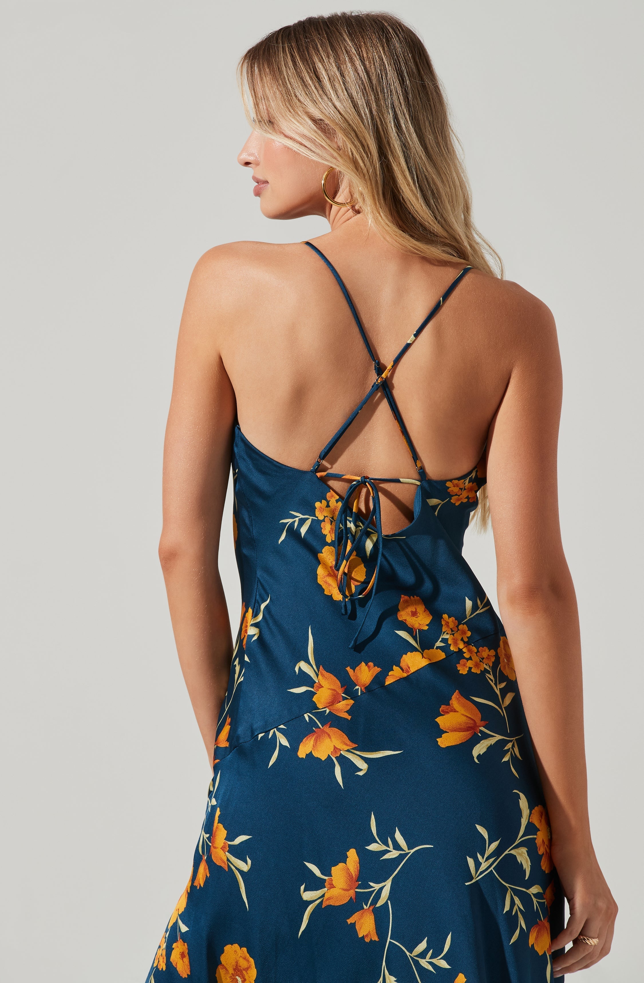 Blue Cowl Sheath Dress - This dress is a cool option to pull off your holiday look. It flaunts a modish cowl neck. This dress goes well with a pair of suede pumps and an envelope clutch.