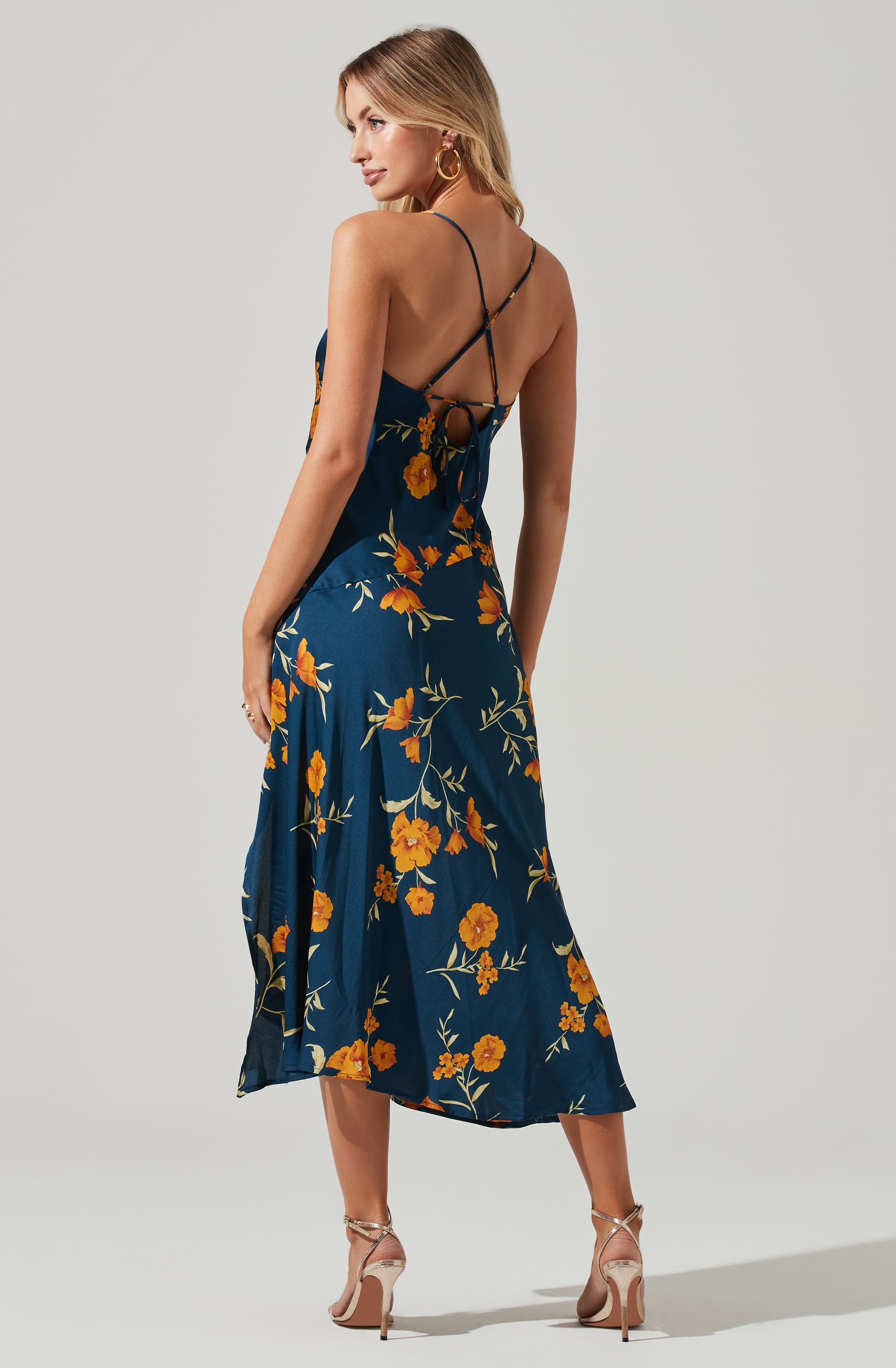 Blue Cowl Sheath Dress - This dress is a cool option to pull off your holiday look. It flaunts a modish cowl neck. This dress goes well with a pair of suede pumps and an envelope clutch.