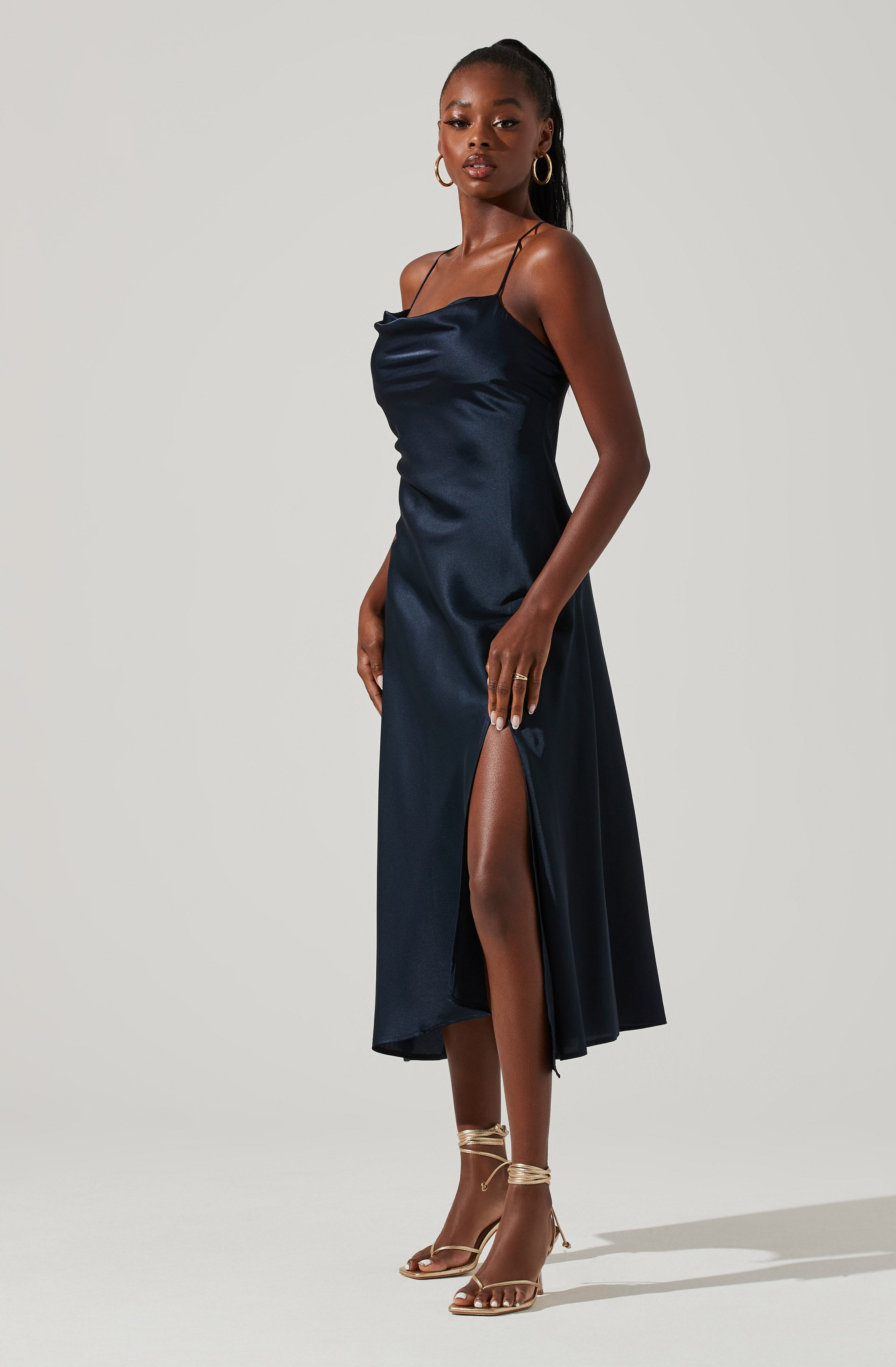 Cowl Sheath Dress - This dress is surely one of the more fashion forward options for your wardrobe. It flaunts an enticing cowl neck. Put together an elegant look, wearing this dress with a pair of pumps and accessorizing with a shoulder bag.