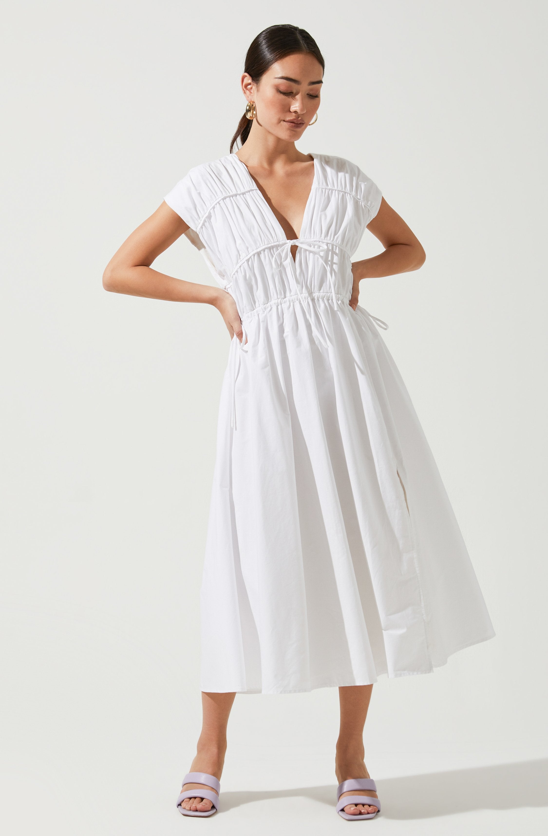 White Solid Dress - This dress is a cool option to pull off your holiday look. It lays emphasis on a stylish V-neck.