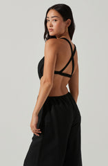 Black Scoop Neck Jumpsuit - When it comes to modish casual outfits, this jumpsuit guarantees a great look. It emphasizes a complementing scoop neck. It's bound to look great with a jacket and a pair of block heels.