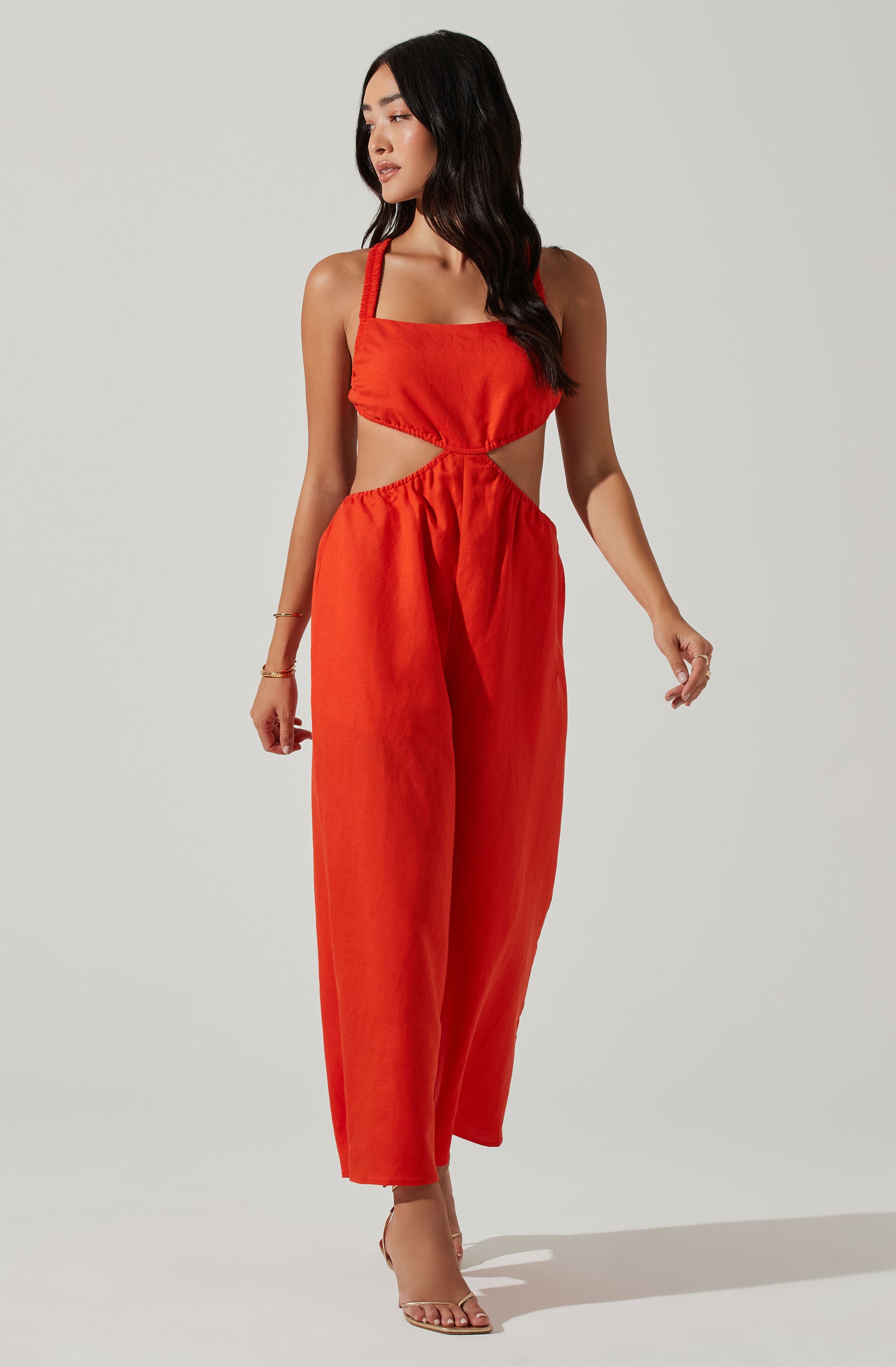 Red Split Neck Jumpsuit - This jumpsuit is an extremely stylish all-day outfit. This jumpsuit goes well with a pair of suede pumps and an envelope clutch.