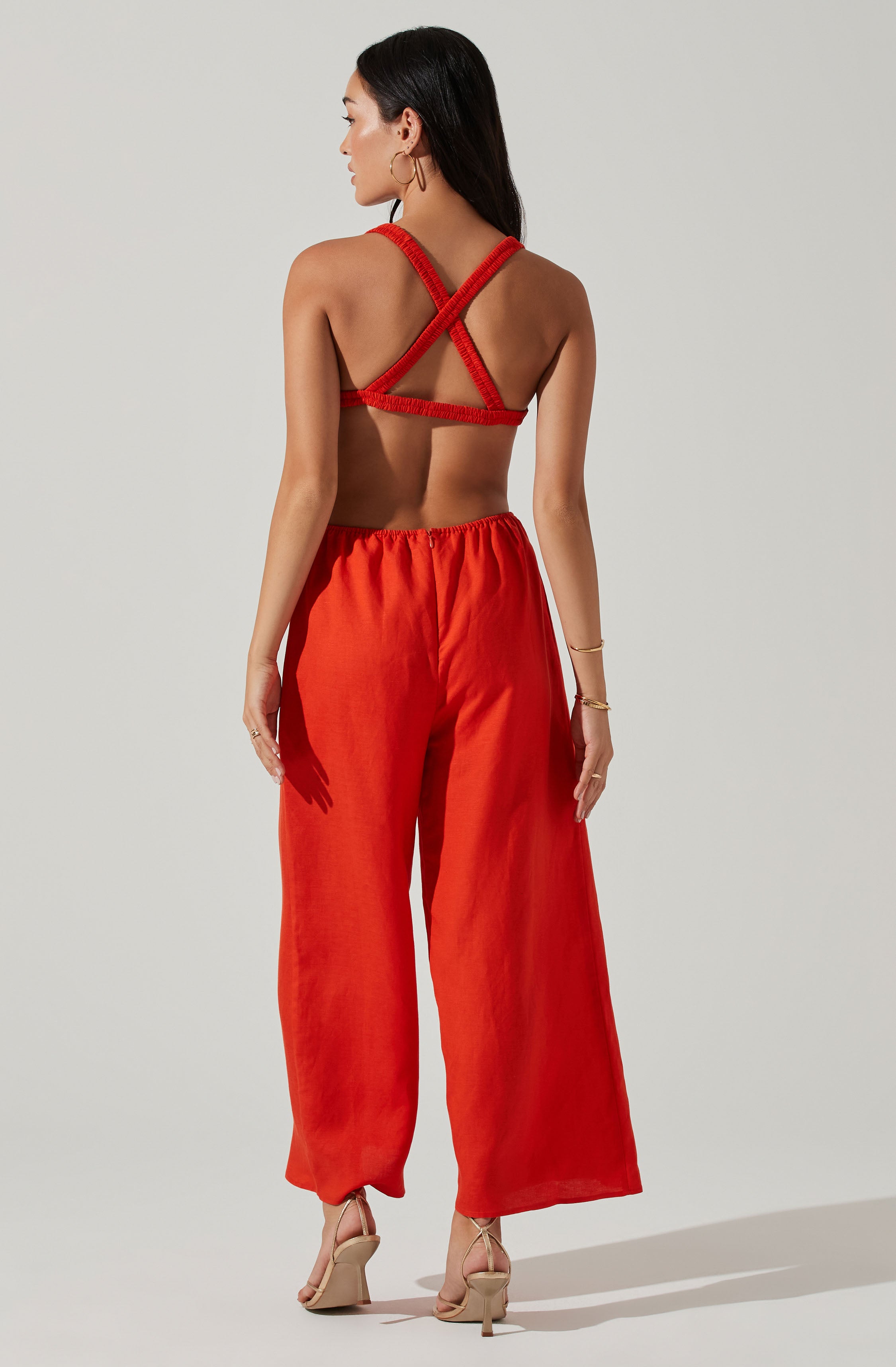 Red Split Neck Jumpsuit - This jumpsuit is an extremely stylish all-day outfit. This jumpsuit goes well with a pair of suede pumps and an envelope clutch.