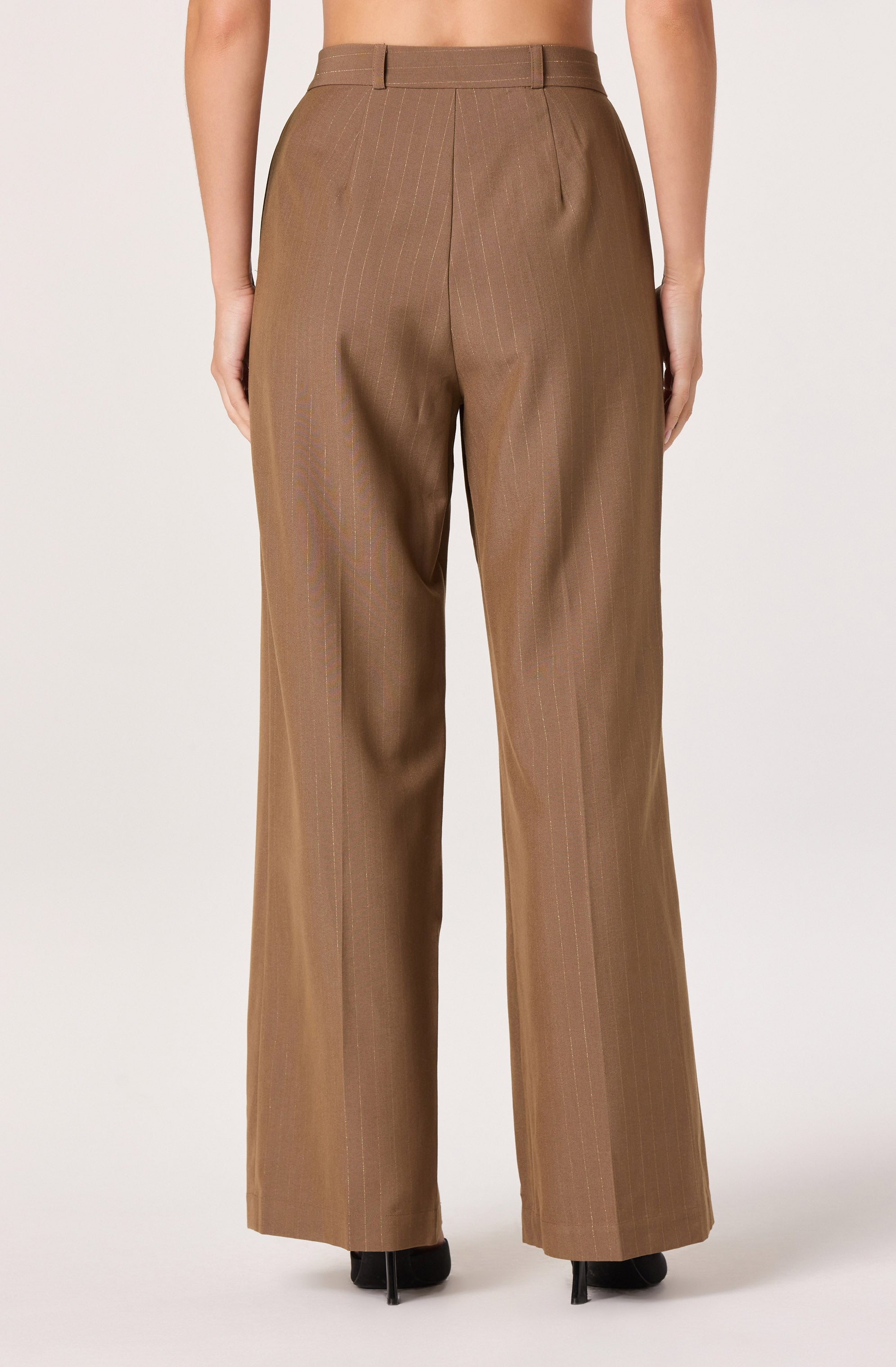 The pants are high-waisted, straight-leg trousers in a light brown color with subtle vertical pinstripes. They feature belt loops, pleats at the front, and are slightly loose-fitting. The fabric has a smooth, structured appearance.