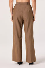 The pants are high-waisted, straight-leg trousers in a light brown color with subtle vertical pinstripes. They feature belt loops, pleats at the front, and are slightly loose-fitting. The fabric has a smooth, structured appearance.