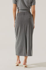 A person is wearing a pair of high-waisted, wide-leg gray trousers with thin vertical pinstripes. The trousers have belt loops at the waistband, side pockets, and a front slit at the hem. The person is also wearing a loose-fitting, short-sleeved gray top that is cropped at the waist, and cream-colored open-toe heeled shoes.