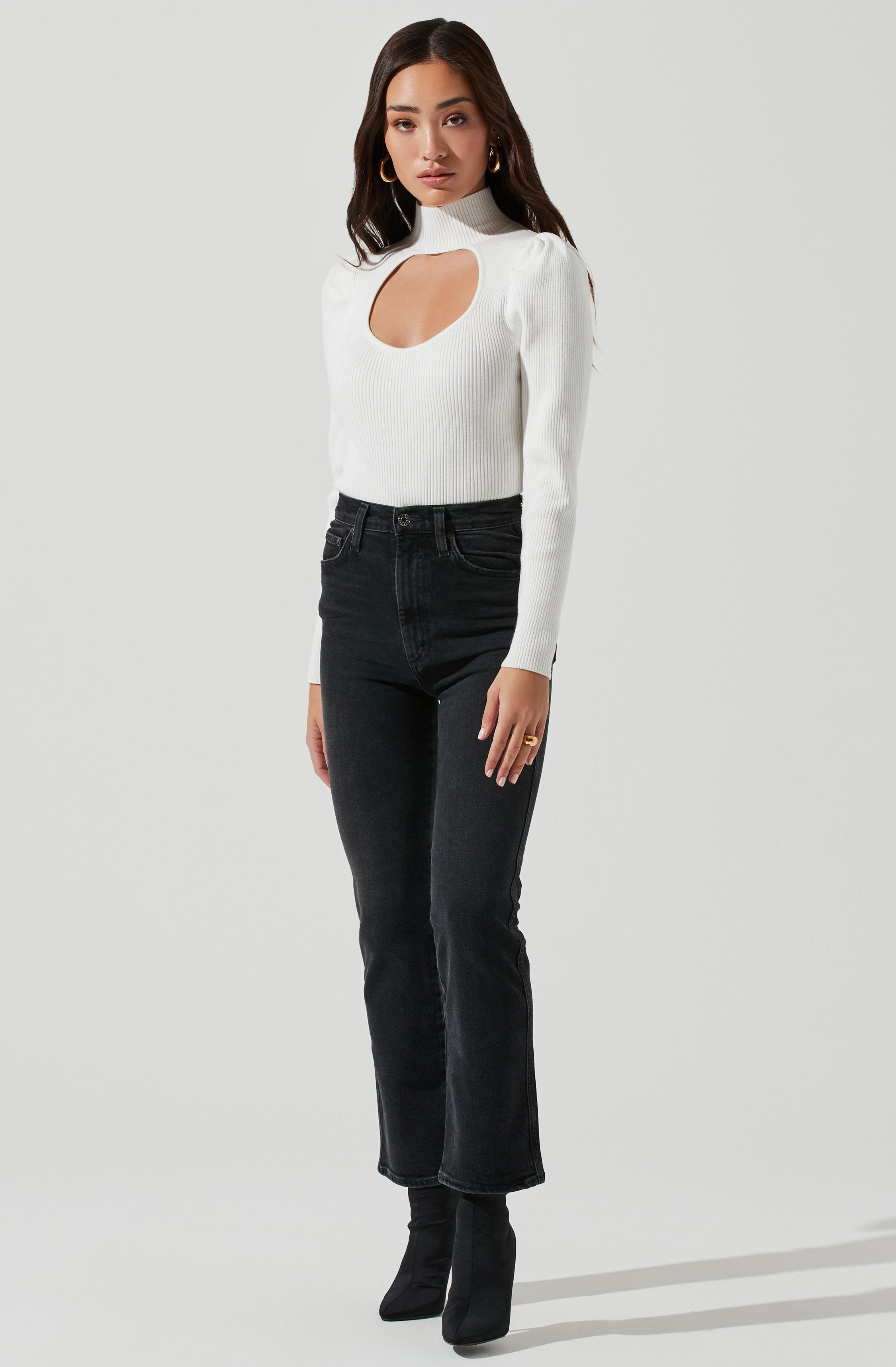 Grey Highneck Knit Top - This is a versatile piece that looks good all day long. It features a slender highneck.