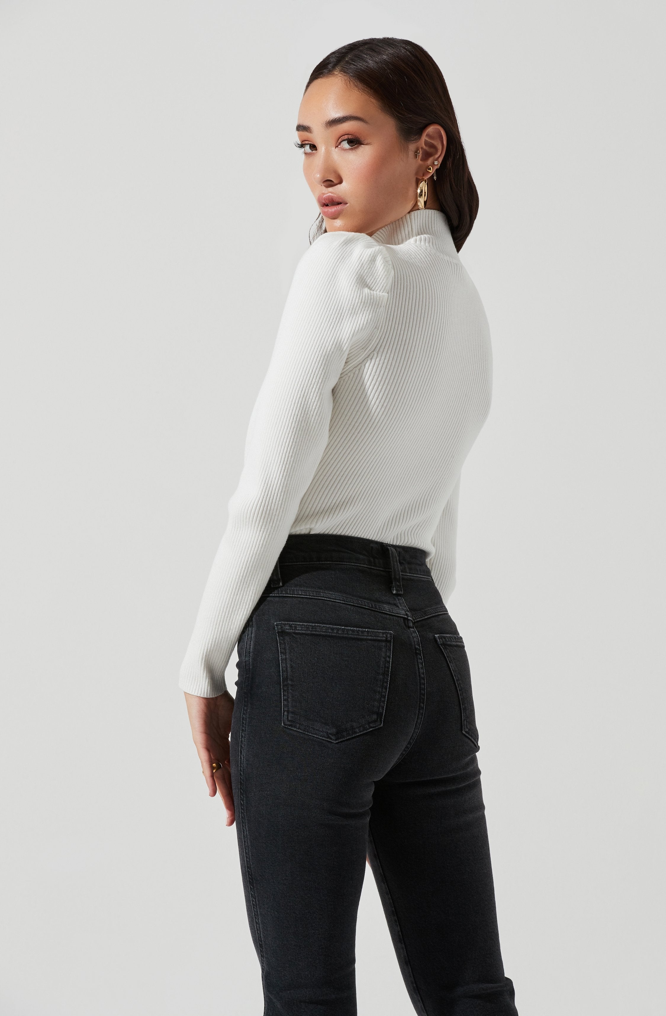 Grey Highneck Knit Top - This is a versatile piece that looks good all day long. It features a slender highneck.