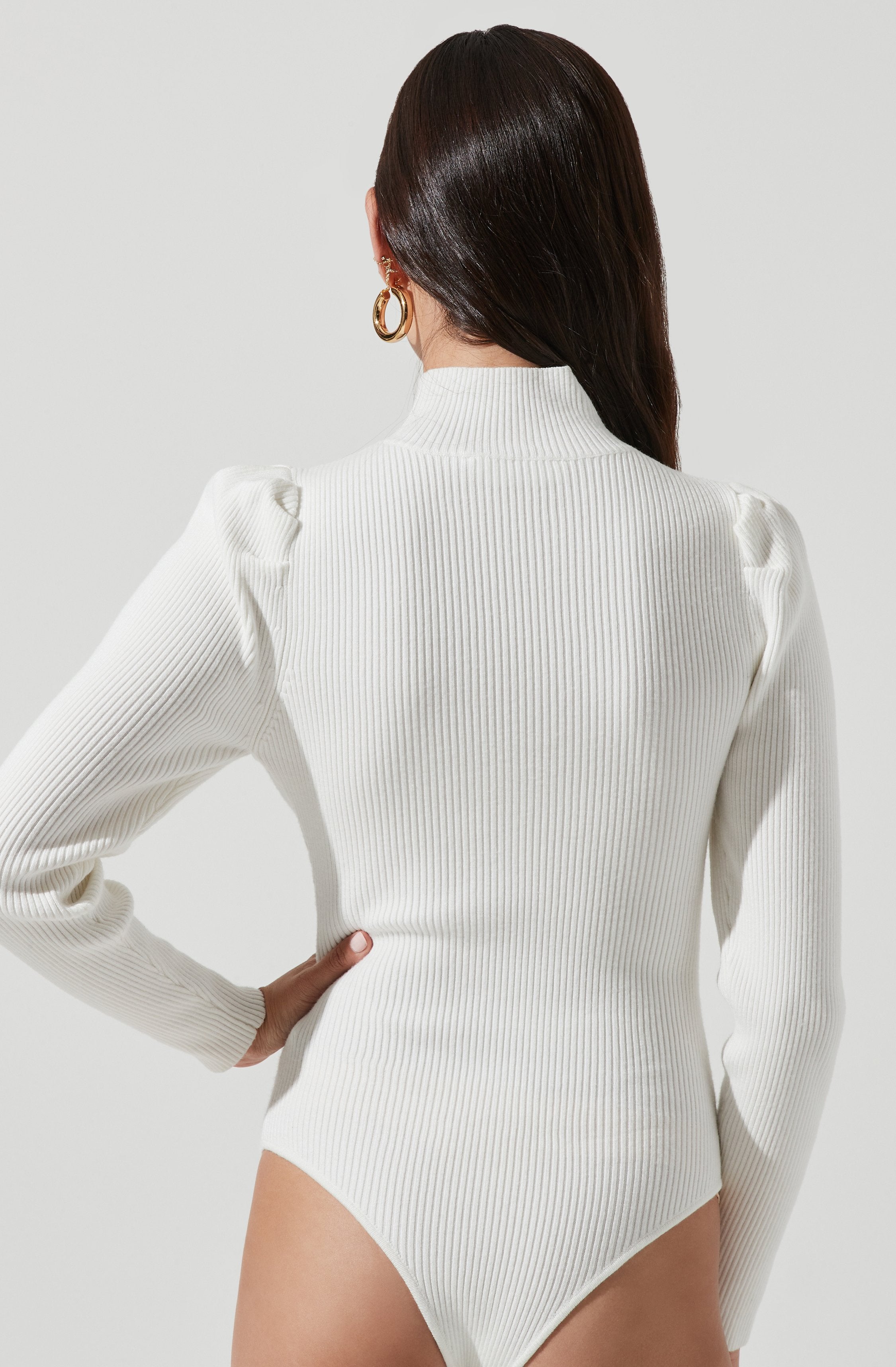 Grey Highneck Knit Top - This is a versatile piece that looks good all day long. It features a slender highneck.