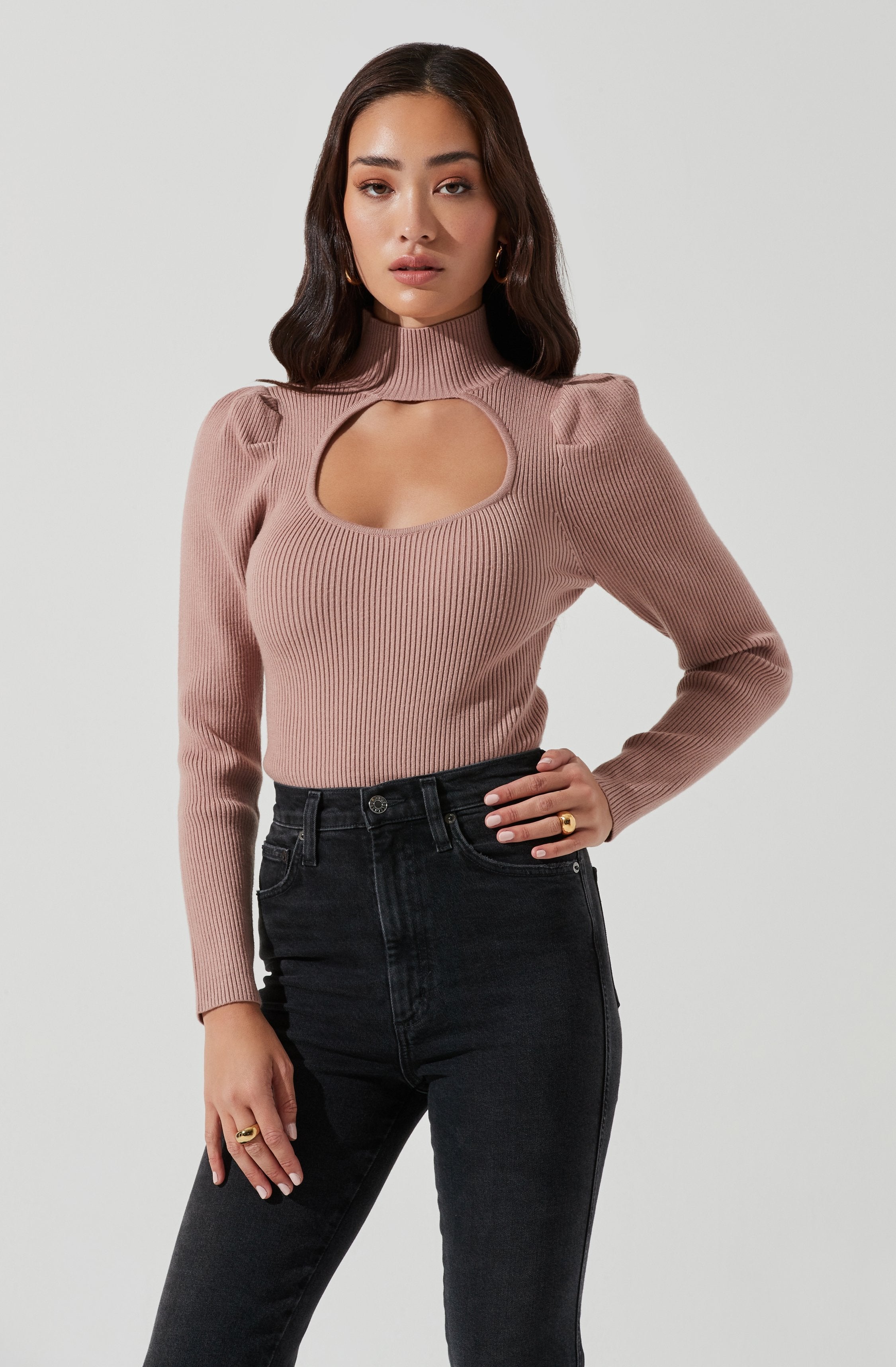 Highneck Knit Top - This is a versatile piece that looks good all day long. It has a slender highneck.