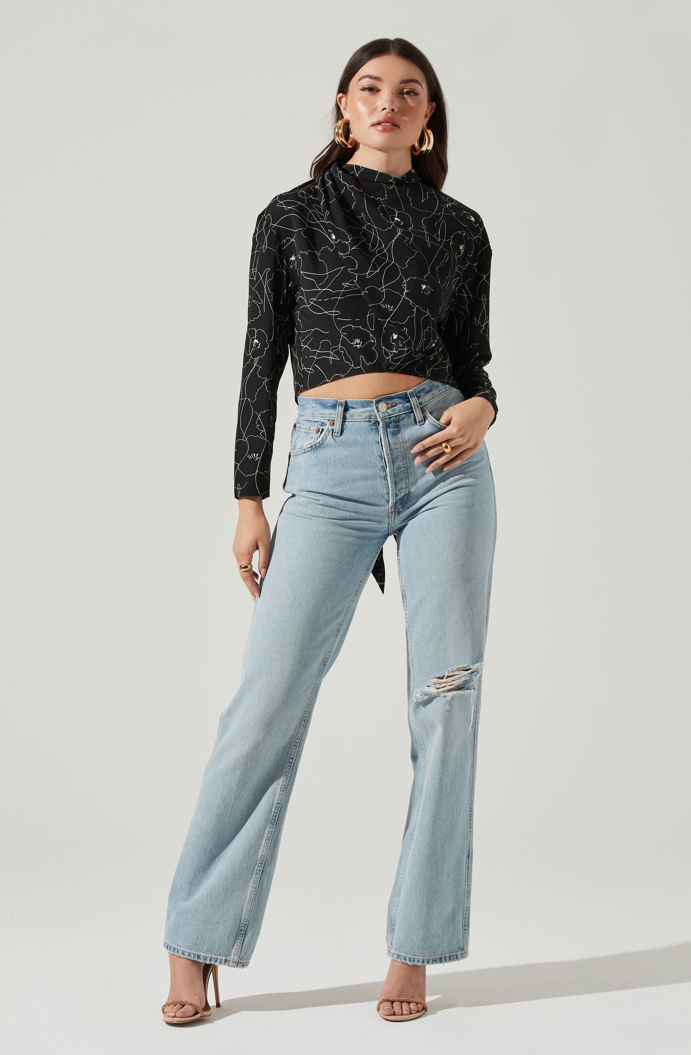 Black Highneck Blouse - This is a versatile piece that looks good all day long. It has a slender highneck. Pair it with culottes or distressed denim shorts.