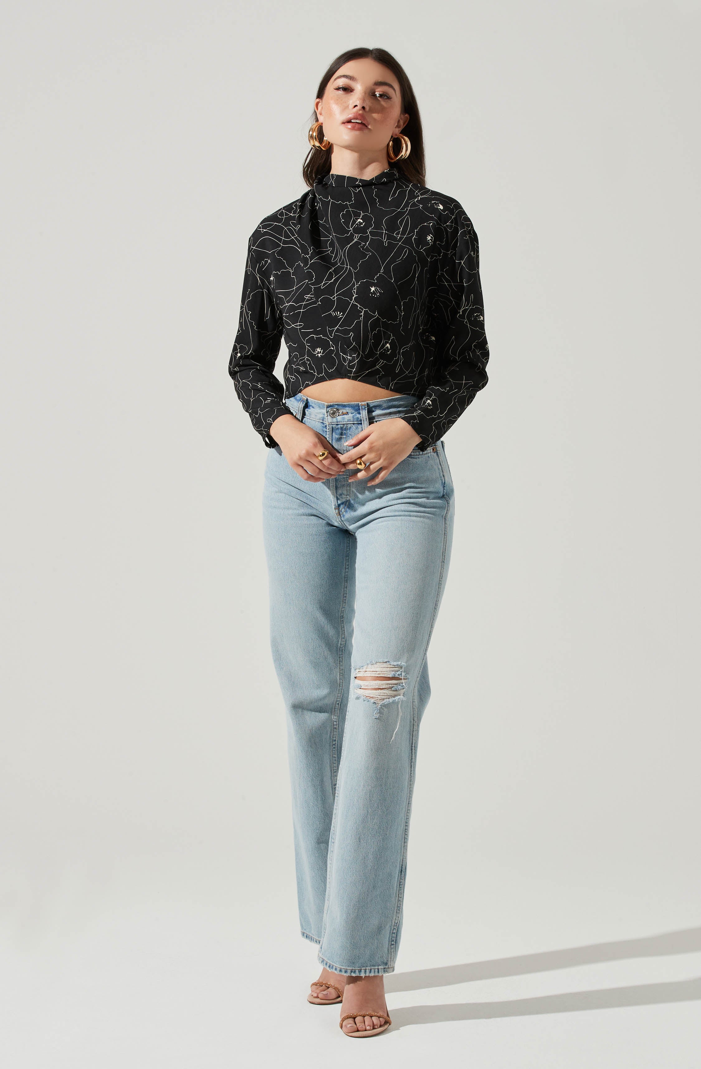 Black Highneck Blouse - This is a versatile piece that looks good all day long. It has a slender highneck. Pair it with culottes or distressed denim shorts.
