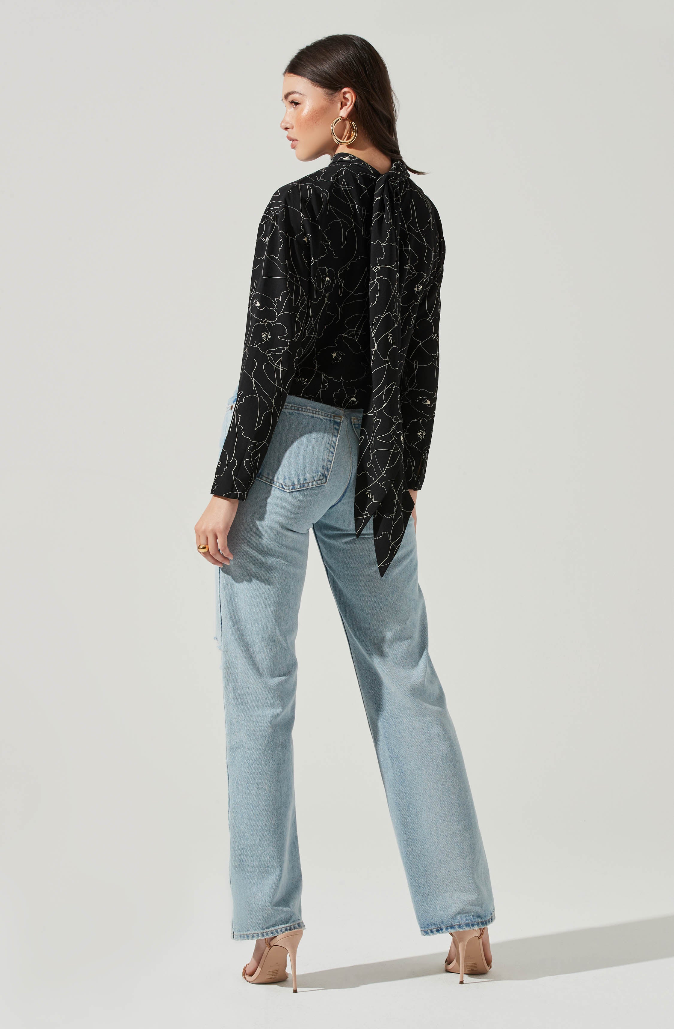 Black Highneck Blouse - This is a versatile piece that looks good all day long. It has a slender highneck. Pair it with culottes or distressed denim shorts.