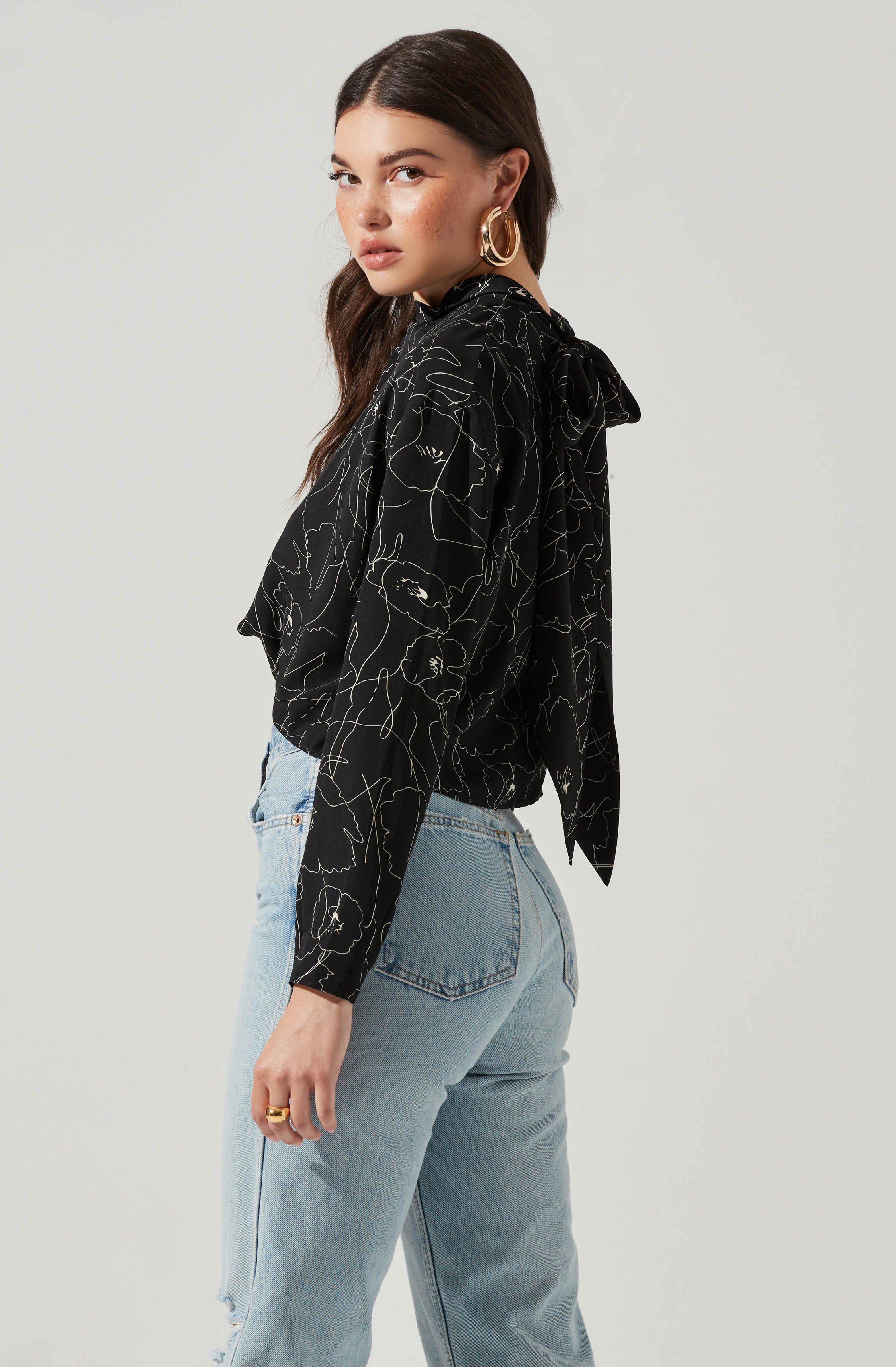 Black Highneck Blouse - This is a versatile piece that looks good all day long. It has a slender highneck. Pair it with culottes or distressed denim shorts.