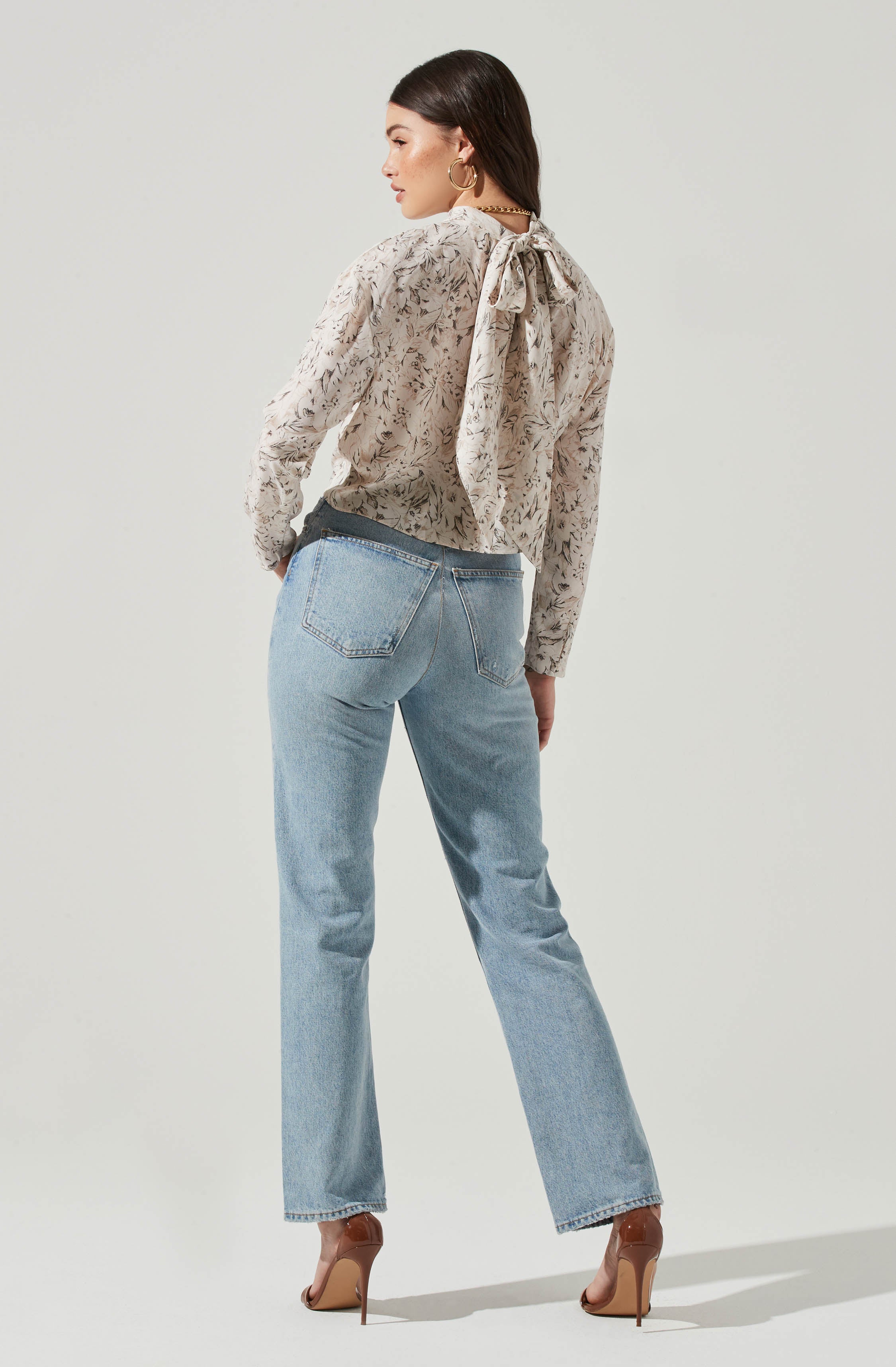 Black Highneck Blouse - This is a versatile piece that looks good all day long. It has a slender highneck. Pair it with culottes or distressed denim shorts.