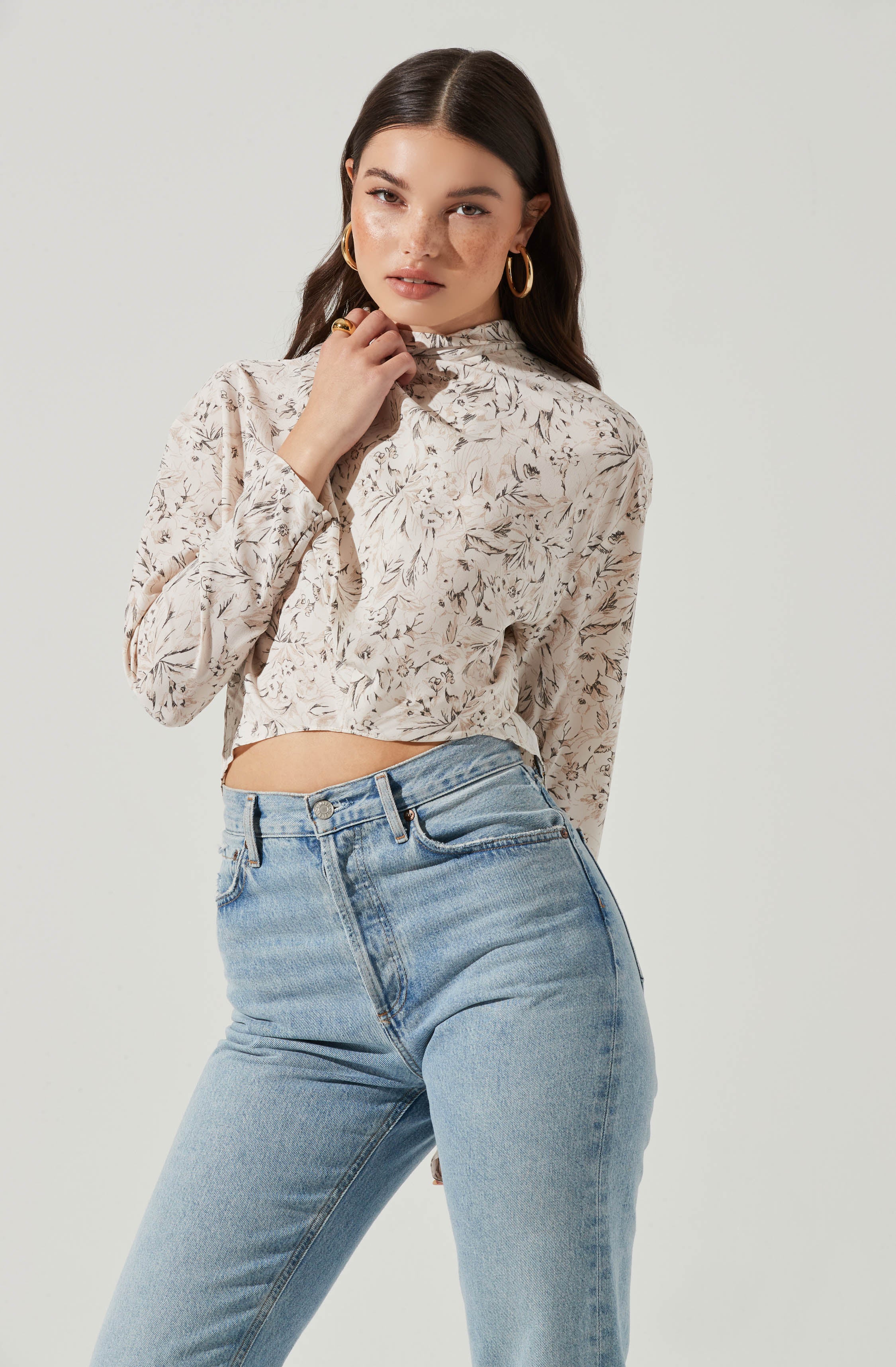 Black Highneck Blouse - This is a versatile piece that looks good all day long. It has a slender highneck. Pair it with culottes or distressed denim shorts.