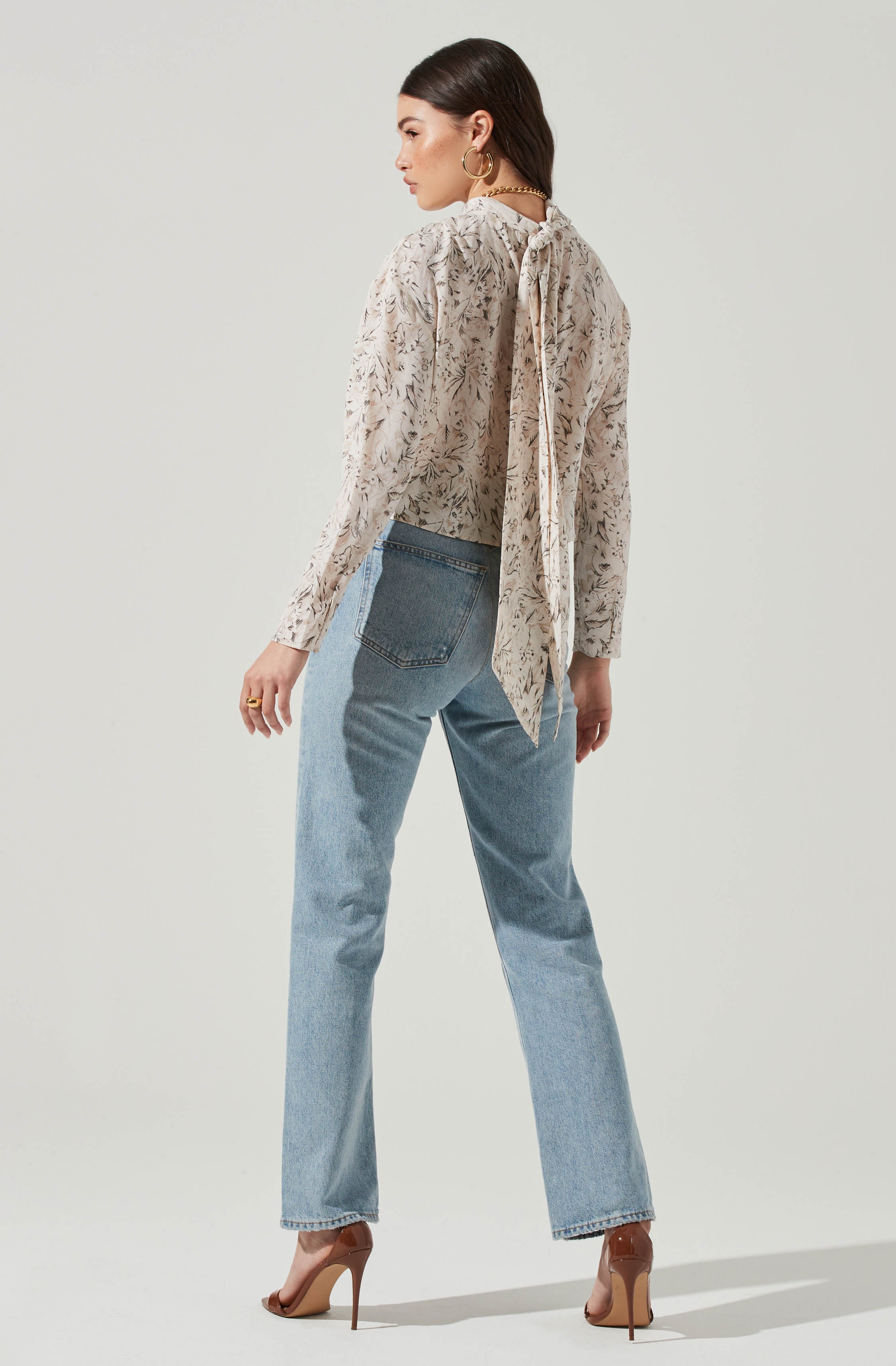 Black Highneck Blouse - This is a versatile piece that looks good all day long. It comes with a slender highneck. Team it up with a tight skirt for a daytime date look.