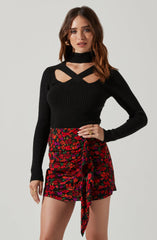 Highneck Knit Top - This is a versatile piece that looks good all day long. It features a slender highneck.