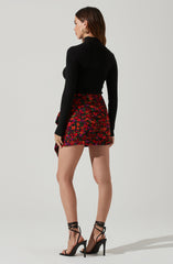 Highneck Knit Top - This is a versatile piece that looks good all day long. It features a slender highneck.