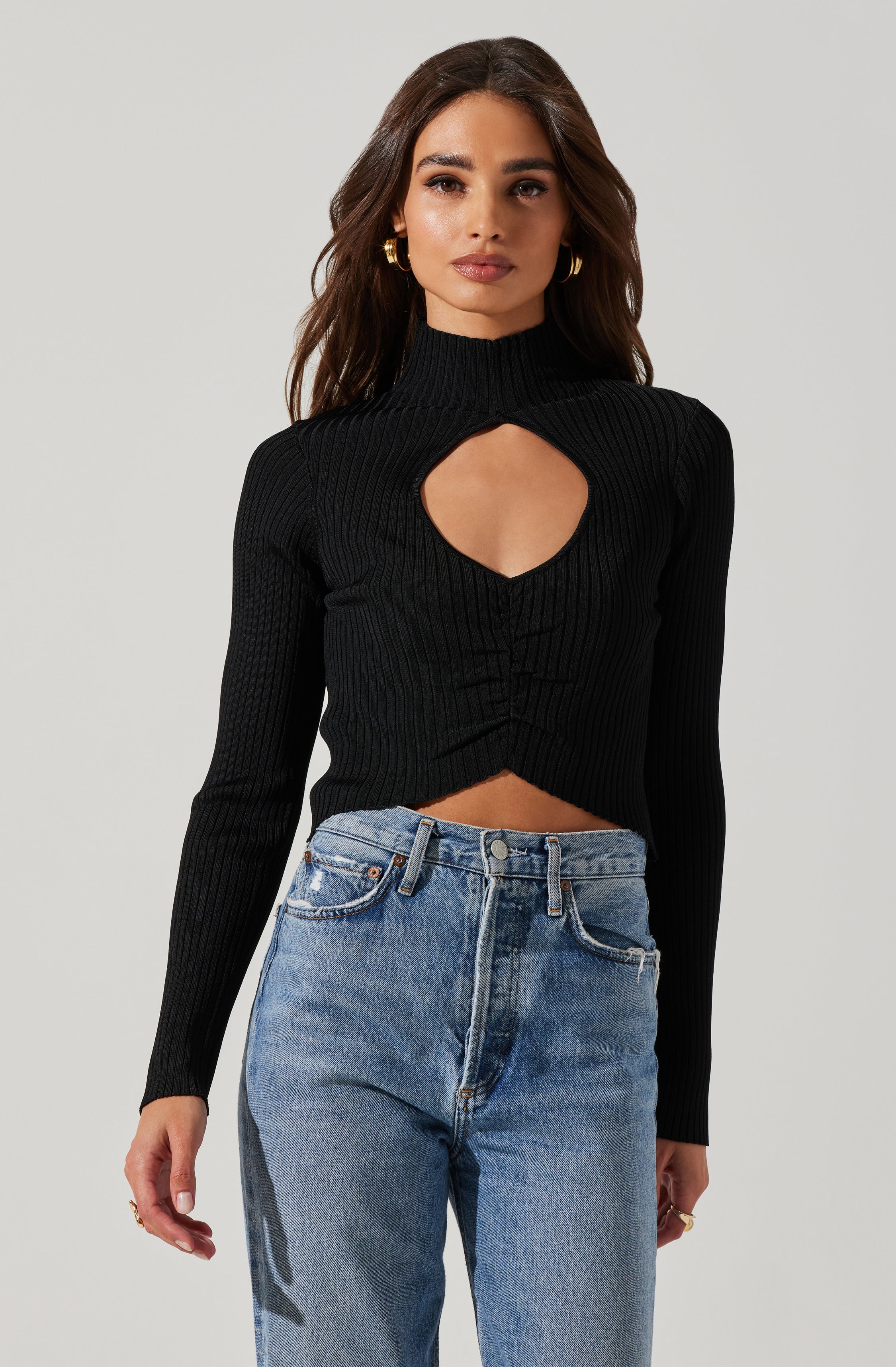 Highneck Knit Top - This is an outfit that easily goes from morning coffee to post-work happy hour. It emphasizes a slender highneck.